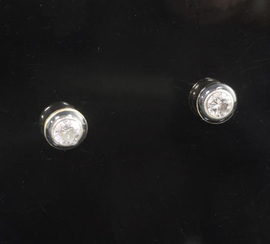 A pair of 18ct gold, diamond and black enamel ear studs, 6mm.